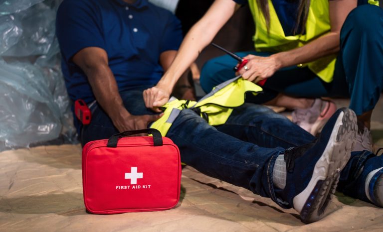 Emergency,Staff,In,Safety,Suit,Help,A,Man,Who,Has